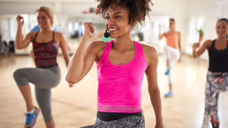 A woman leading a fitness class. 