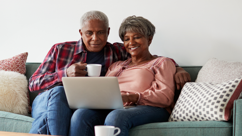 A seniors couple on their computer. 